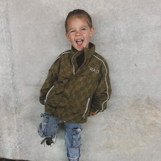 Little Rad Things Storm Rider waterproof jacket in army green, featuring a durable, waterproof design for outdoor wear.