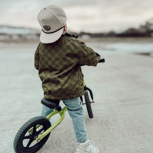 Little Rad Things Storm Rider waterproof jacket in army green, with hood and zip closure, outdoor rain protection for kids