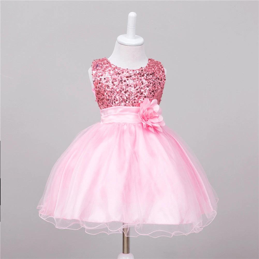 Baby sequin dress by MANDOTOS featuring flower girl or princess style, with shimmering sequins and delicate design for special occasions.