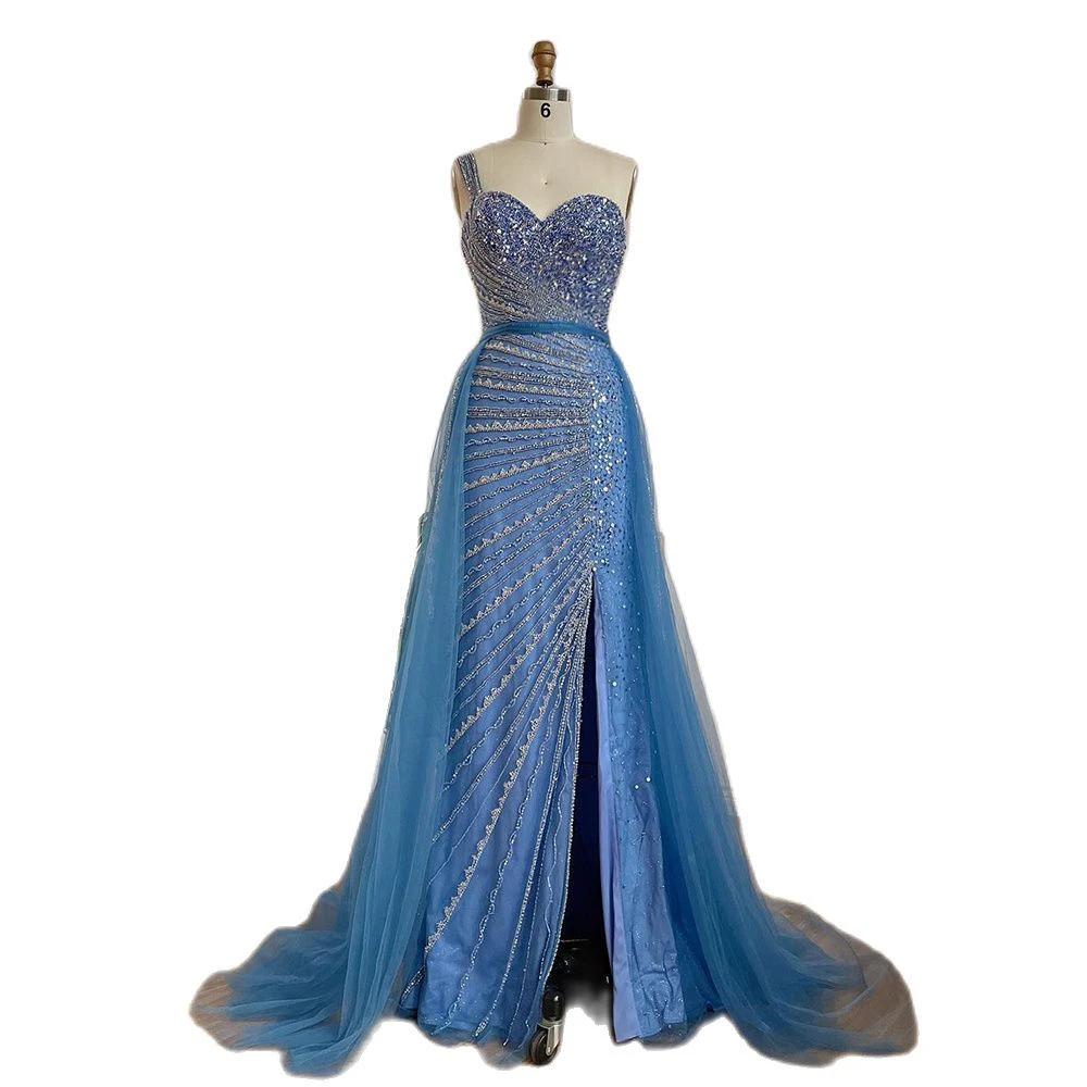 Blue handmade beaded split shoulder fishtail dress by MANDOTOS, featuring intricate beadwork and elegant flowing fabric.