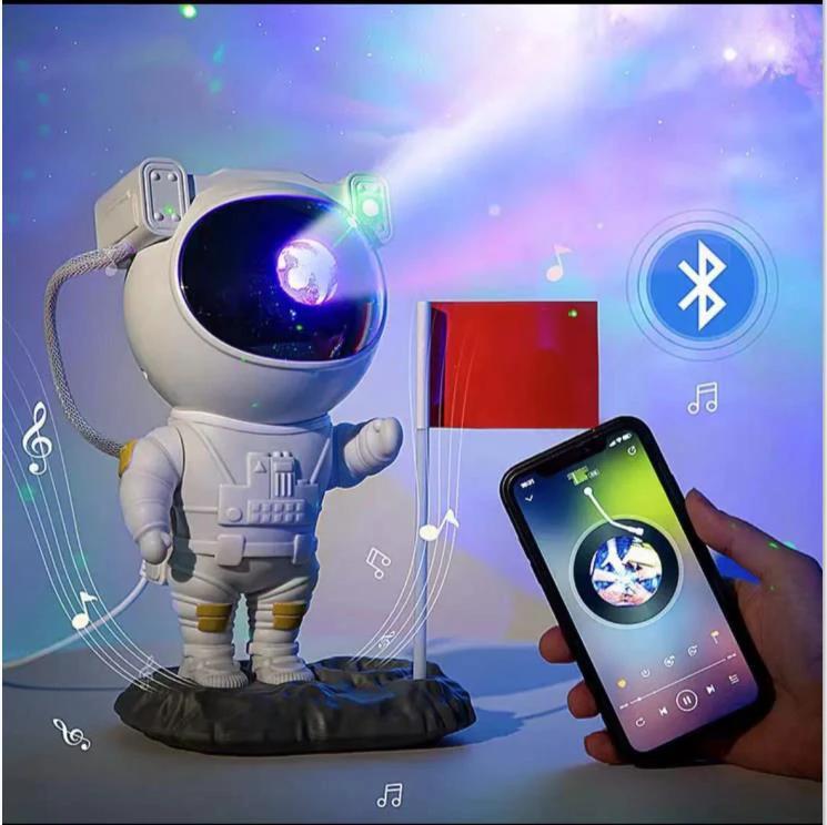 Mandotos creative astronaut galaxy starry sky projector nightlight USB bedroom table lamp showing celestial scene and atmospheric lighting.