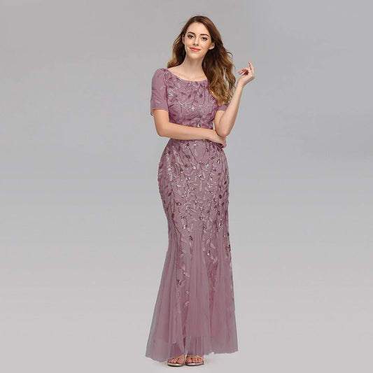Elegant MANDOTOS evening dress in black with a flowing silhouette, perfect for formal occasions and evening events.
