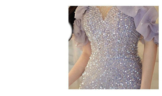 Elegant women's halter evening gown by MANDOTOS featuring a classic French style and flowing fabric.