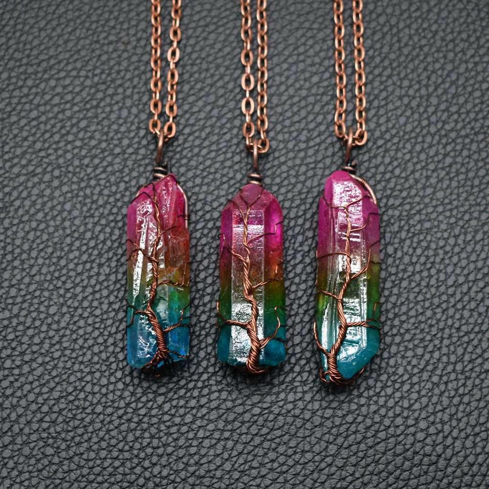 Mandotos crystal stone pillar Tree of Life pendant necklace showcasing a detailed, elegant design on a chain.