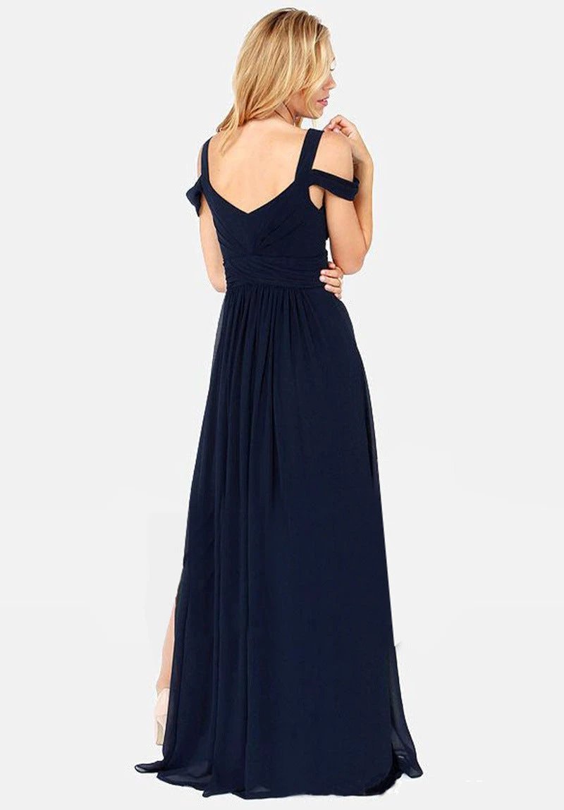 Long floor-length elegant Greek style pleated dress by MANDOTOS, featuring flowing fabric and sophisticated design.