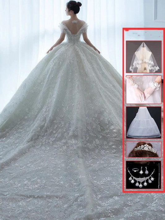 Off-shoulder French main wedding dress by MANDOTOS featuring elegant design and delicate fabric for a romantic bridal look.
