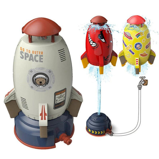 Mandotos outdoor rocket launcher water sprinkler toy for kids, spraying water in garden or lawn during summer play.