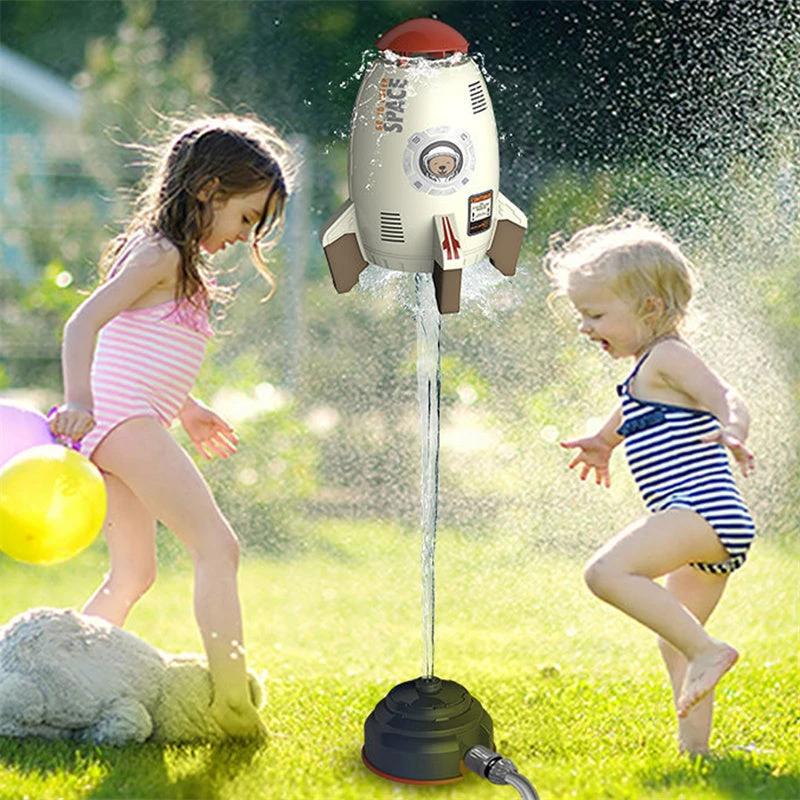 Mandotos outdoor rocket launcher toy with water pressure lift sprinkler for kids, spraying water in garden or lawn during summer.