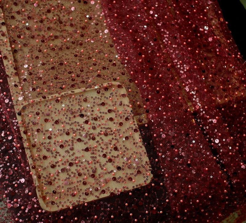 Mandotos sequined pear dress with embroidery lace, asymmetric design, and single sleeve for elegant evening wear.