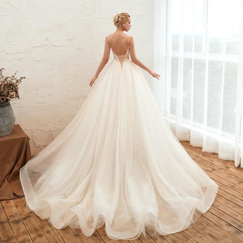 Starry Sky Luxury wedding dress by MANDOTOS featuring an IG tail, thin design, and a sleek, dreamlike silhouette.