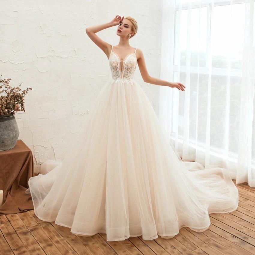 Elegant Starry Sky Luxury wedding dress by MANDOTOS featuring a thin, beakless design and dream-like silhouette.