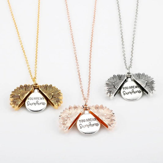 Mandotos sunflower double lettering necklace featuring a gold chain and sunflower pendant with custom engraved initials.