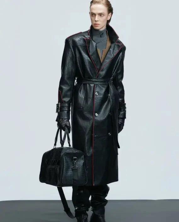 Mandotos wide shoulder long coat with fur collar, metal belt detail, and waist-length cut, stylish and warm outerwear.