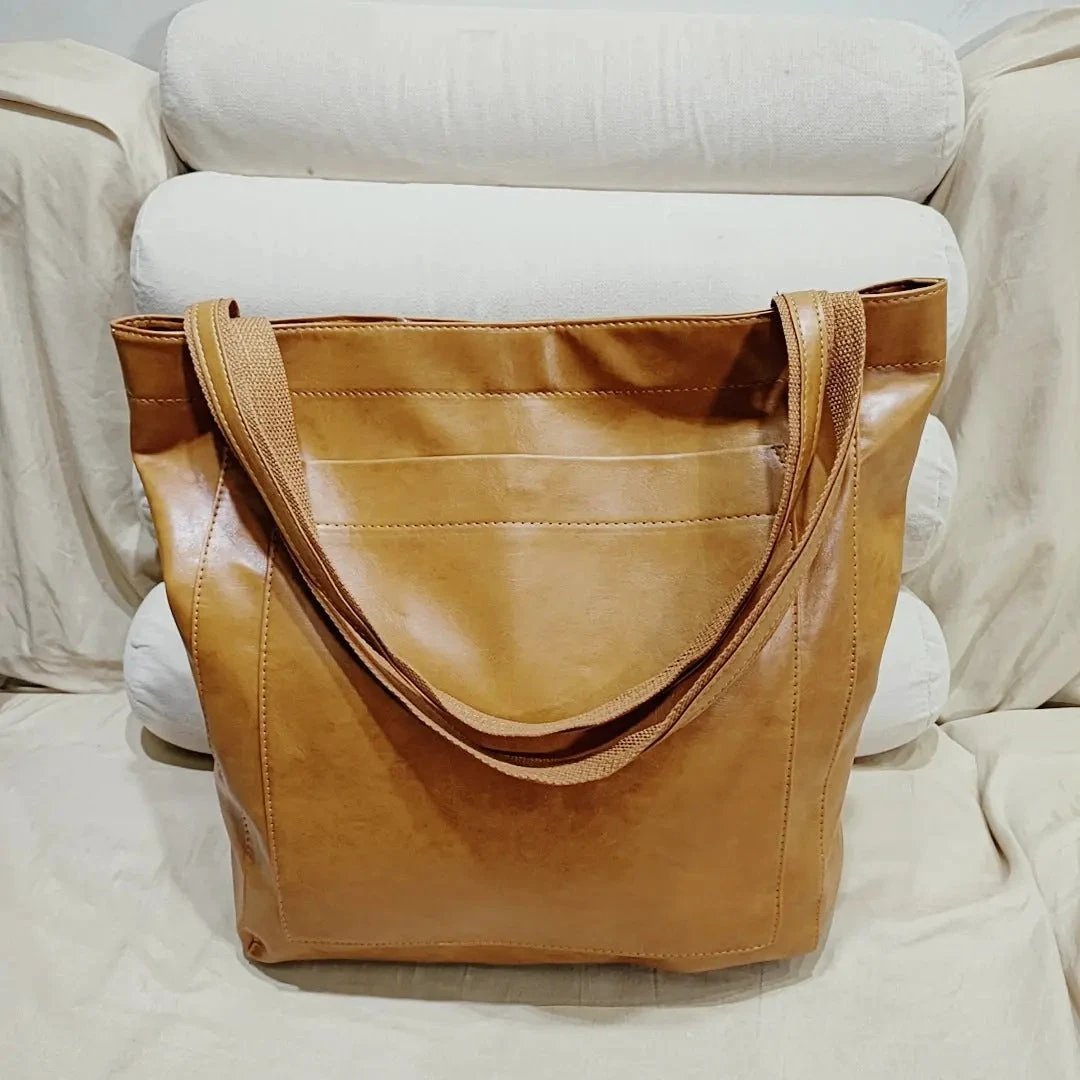 Women's soft leather shoulder bag with pocket, vintage style from MANDOTOS, featuring a compact and portable design.