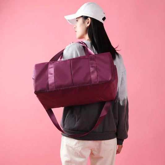 Mandotos waterproof fitness sports travel duffel bag with shoulder strap, ideal for gym, swim, and weekend trips for women and men.