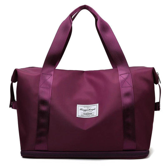Mandotos large capacity travel bag for fitness, gym, workout, yoga, and outdoor activities with shoulder strap and multiple compartments.