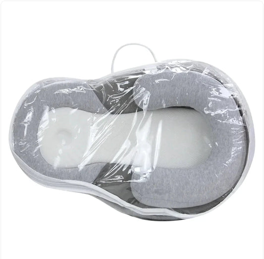 Baby Anti-Spit Up Pillow by MANDOTOS, soft and supportive pillow designed to reduce spit-up for infants.