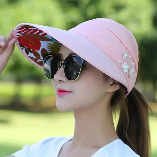 Mandotos Breezy Pearl Visor Hat with wide brim and pearl accents, perfect for sun protection and stylish outdoor wear.