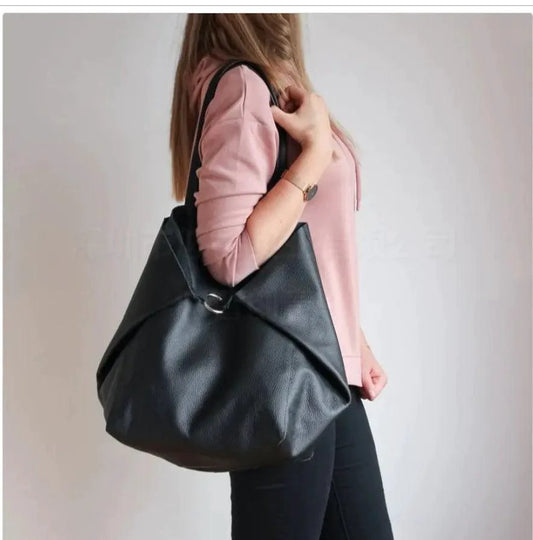 Mandotos chic leather tote handbag with sturdy handles, spacious interior, and sleek design for versatile everyday use.