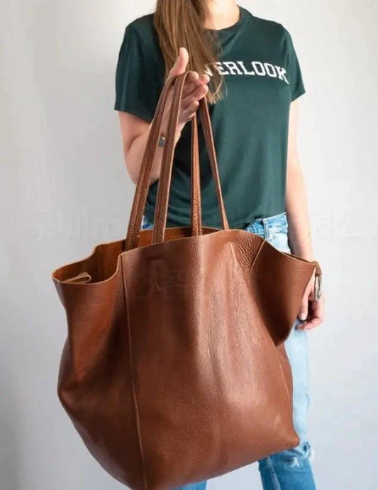 Mandotos chic leather tote handbag with sturdy handles and spacious interior, stylish accessory for everyday use.