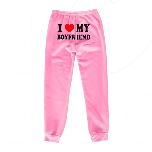 Mandotos Chic Love Print Trousers featuring a stylish heart pattern and relaxed fit, perfect for casual and trendy outfits.