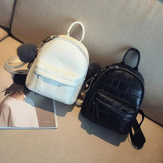 Mandotos chic mini leather backpack with adjustable straps and silver hardware, ideal for stylish everyday use.