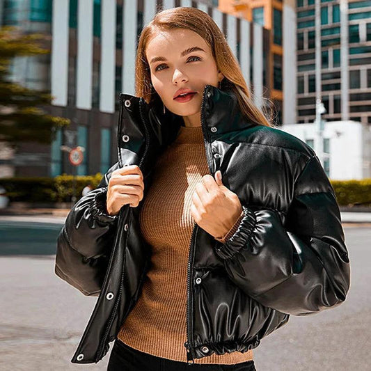 Mandotos chic winter PU leather jacket displayed on a hanger, showcasing a stylish, fitted design with a smooth, matte finish.
