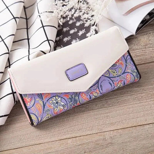 Elegant women's leather clutch wallet and card holder by MANDOTOS, featuring a sleek design with multiple card slots and a secure closure.