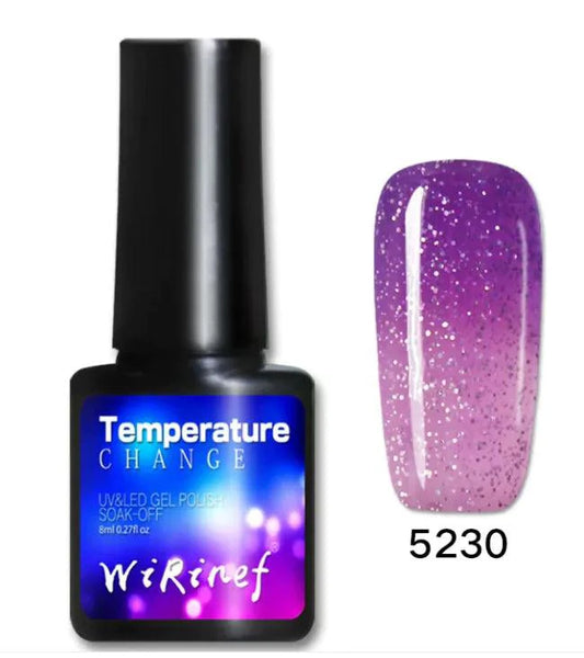 Mandotos Chromatic Nail Adhesive in a clear bottle with a brush applicator for easy nail glue application.