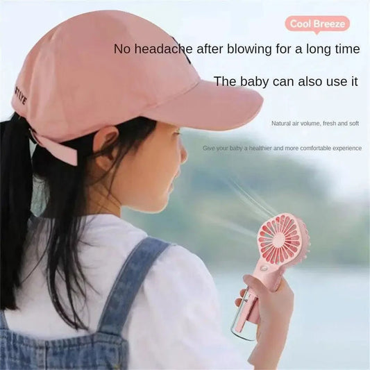 Mandotos compact hydrating mist fan with a sleek design, featuring a spray nozzle and fan blades for cooling and hydration.