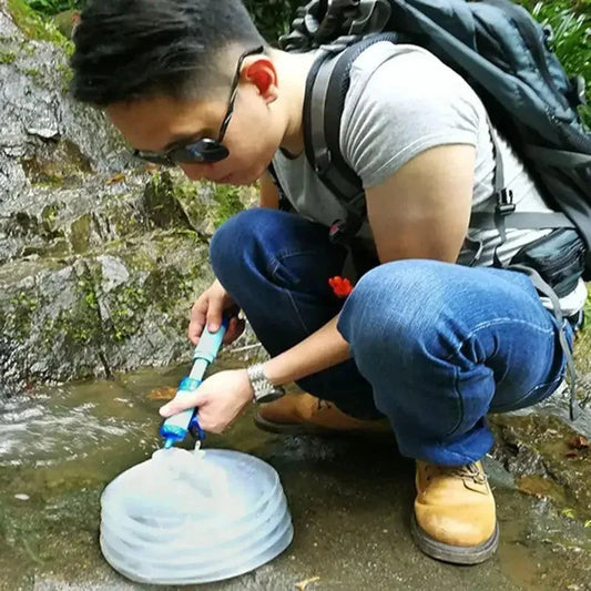 Mandotos compact travel water filter attached to a water bottle, portable and lightweight for outdoor adventures and travel.