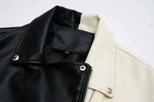 Mandotos contrast vegan leather jacket with stylish black and white color blocking, front zipper, and collar detail.