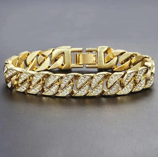 Gold Cuban curb bracelet by MANDOTOS featuring interlinked flat, rounded links for a stylish, bold jewelry accessory.