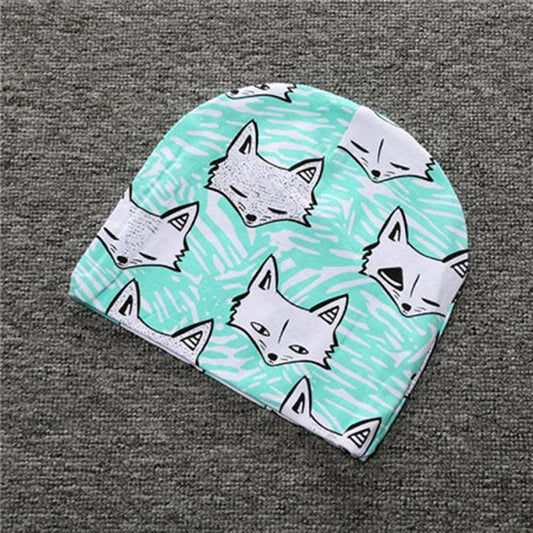 Soft cotton baby hat by MANDOTOS for infants and toddlers, featuring a cute, cozy design perfect for gentle wear.