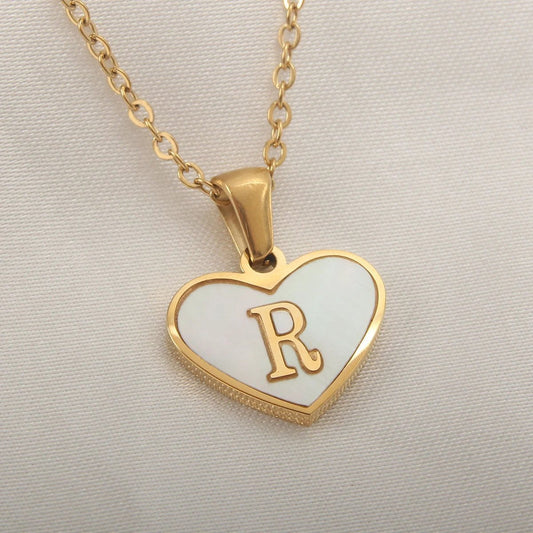 Mandotos 26-letter heart-shaped necklace with white shell accents, personalized clavicle chain jewelry for women, perfect for Valentine's Day.