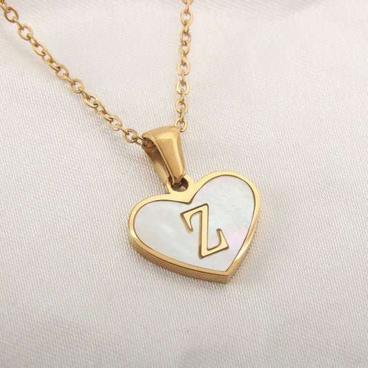 White shell heart-shaped letter necklace by MANDOTOS, personalized clavicle chain jewelry for women, perfect for Valentine's Day.