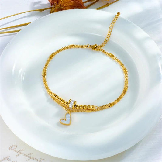 Mandotos boho love heart ankle chain with double layer design, charm tassels, and leg chain for women’s party jewelry accessories.