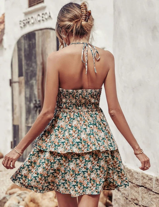 Mandotos summer printed halter dress with boho style, backless design, ruffled A-line silhouette, ideal for beach and casual wear.