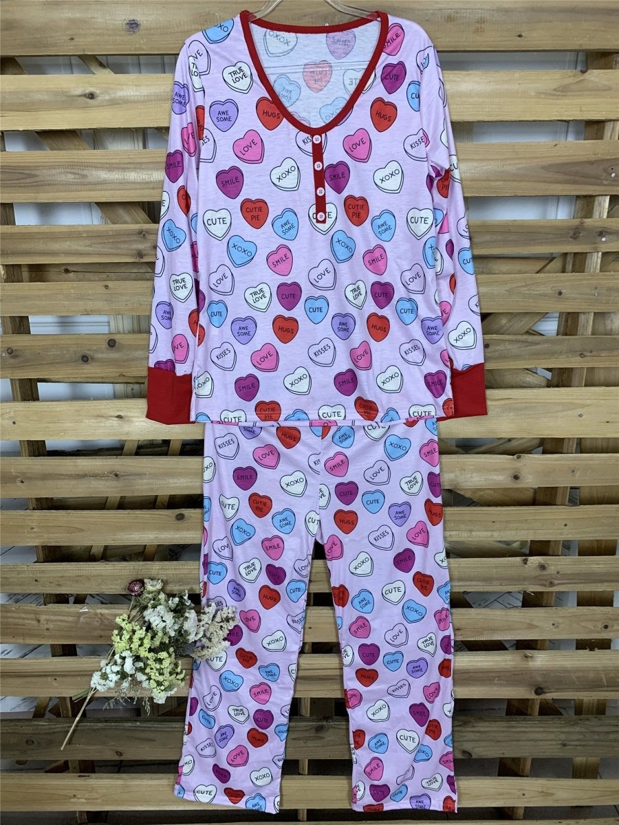 Matching Valentine's Day love print pajamas for parent and child by MANDOTOS, featuring cozy, festive sleepwear with love-themed designs.