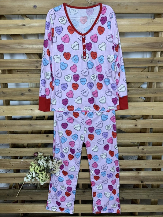 Matching Valentine's Day love print pajamas for parent and child by MANDOTOS, featuring cozy, festive sleepwear with love-themed designs.