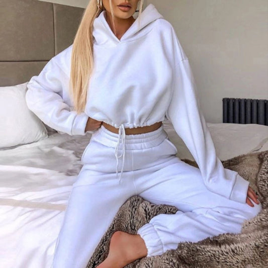 Women's 2-piece jogging suit by MANDOTOS featuring a sexy long sleeve hoodie and matching athletic pants.
