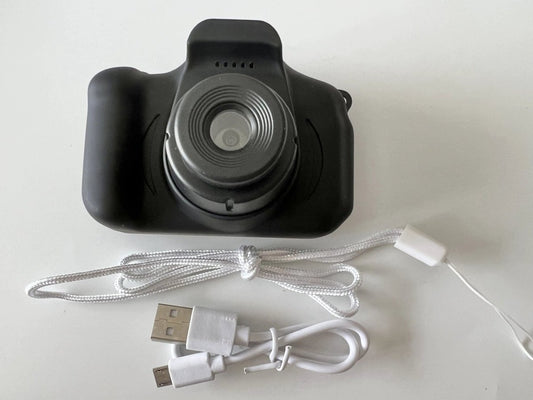Mandotos X2 HD Mini Cartoon Kids Digital Camera showing colorful cartoon design and compact size for children.