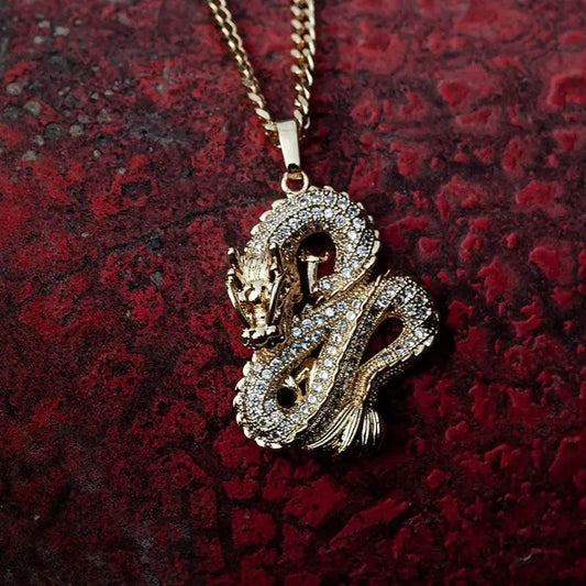 Elegant gold zircon dragon pendant from MANDOTOS featuring a detailed dragon design and sparkling zircon stones.
