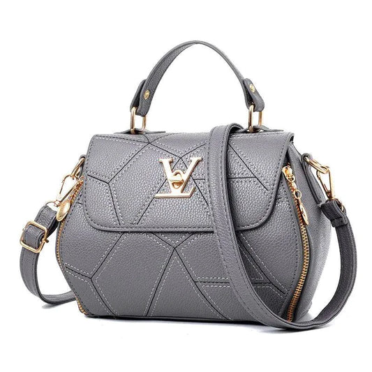 Elegant leather tote bag by MANDOTOS featuring sleek design, sturdy handles, and spacious interior for everyday use.