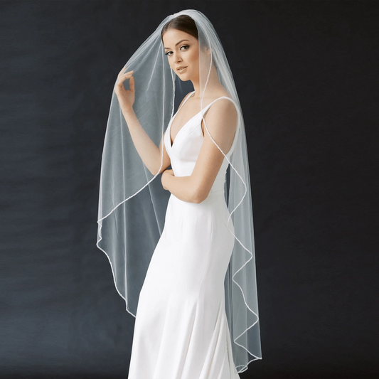 Long flowing veil from ElegantBride V14 collection by MANDOTOS, sheer tulle fabric with delicate edge detailing.
