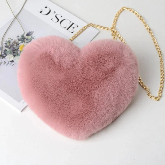 Mandotos women's heart-shaped faux fur crossbody bag with plush texture, chain strap, and soft shoulder design for stylish shoppers.