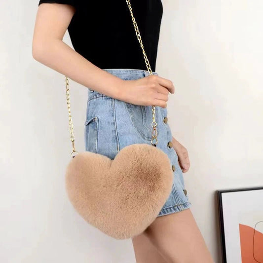 Mandotos women's heart-shaped faux fur crossbody handbag with plush soft chains, perfect for stylish shoulder or tote use.