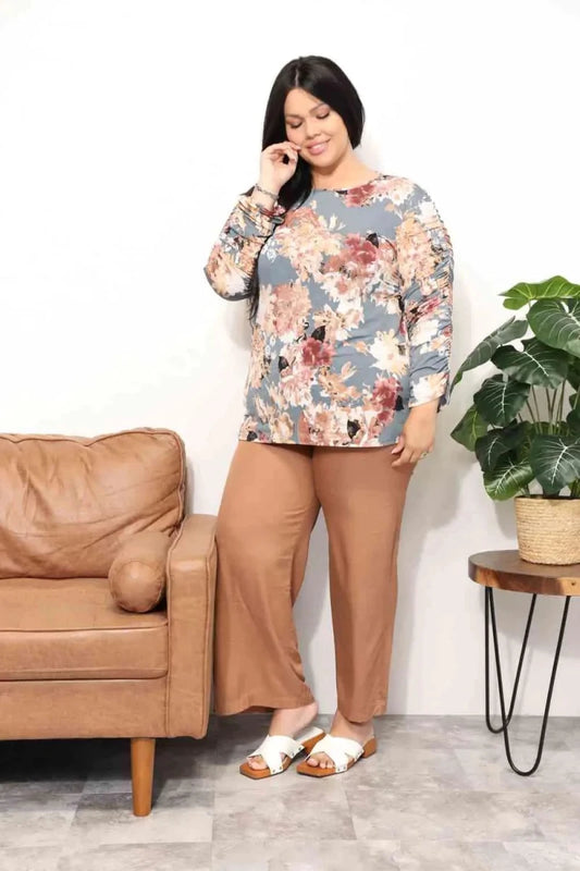 Mandotos Floral Grace boatneck blouse featuring a floral pattern, lightweight fabric, and relaxed fit, perfect for casual or dressy occasions.