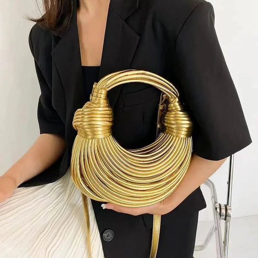 Mandotos gold luxury designer handbag for women, handwoven noodle style with rope knotted details, silver evening clutch.