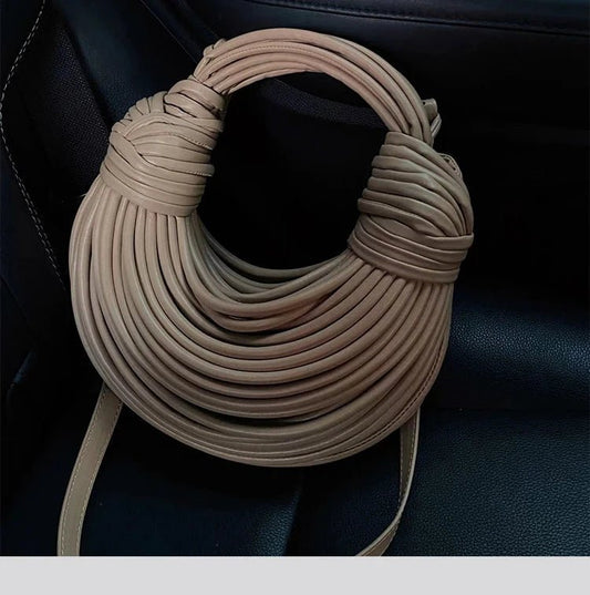 Mandotos women's 2025 gold luxury designer handbag with handwoven noodle design, rope knotted pull, and silver evening clutch style.